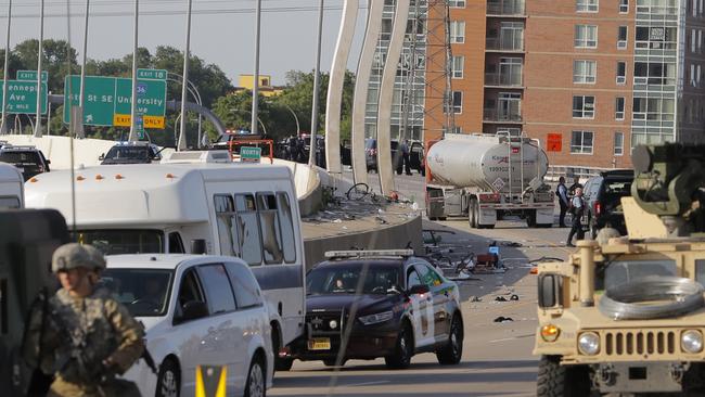 Authorities stand near the truck in Minneapolis.