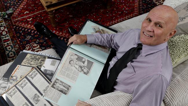 Former owner of Billy's Beach House, Bill James, looking over old records and photo albums of the good olds. The Beach House has now been demolished.