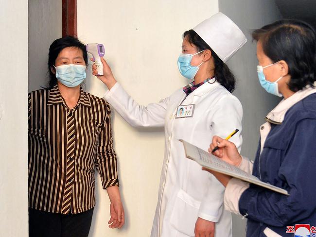 A North Korean woman is tested for Covid. Picture: KCNA via KNS/AFP