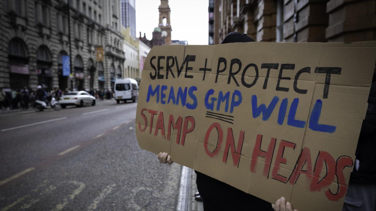 Protester holds a placard during the demonstration against the Greater Manchester Police (GMP). Picture: Andy Barton / SOPA Images/Sipa USA/AAP