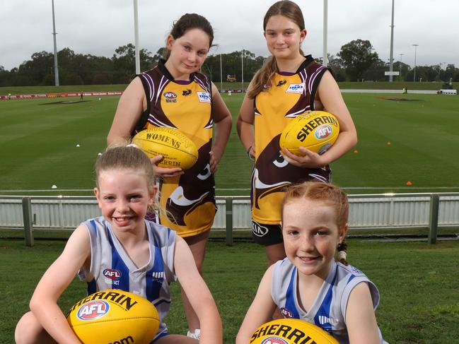 BLACKTOWN ADVOCATE/AAP. (L-R) Millie Spencer(9) from Blue Mountains Kangaroos, Piper Lillia(10) and Mackenzie Lillia(11) both from Baulkham Hills Hawks and Abby Croucher(9) from Blue Mountains Kangaroos pose for photos at Blacktown International Sportspark, Saturday, 8th February 2020. The AFLW league is encouraging girls of all ages to play women's AFL. (AAP IMAGE / Robert Pozo)