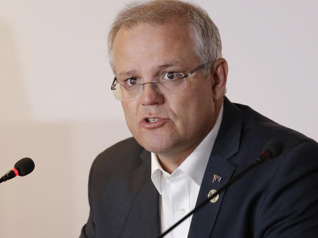 Scott Morrison’s government will unveil a package targeting tech giants in a bid to make them liable for harmful content. Picture: AP/Aaron Favila