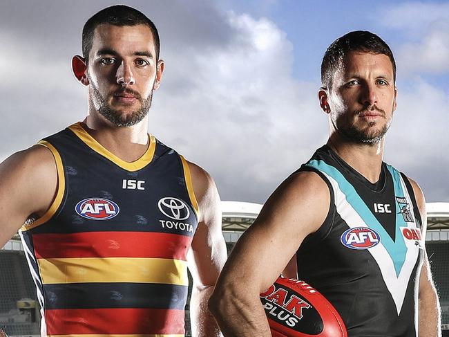 03/08/18 - AFL SHOWDOWN 45. Adelaide Crows captain Taylor Walker with Port Adelaide Captain Travis Boak. Picture SARAH REED