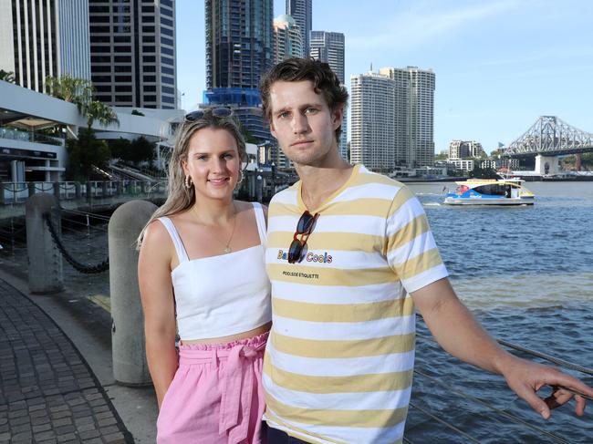 Sophie Tuffley, Windsor, 28, and Luke Condon, Windsor, 28, walking along City Reach Boardwalk, BrisbaneÃs central business district is in a battle for survival with soaring vacancy rates and a growing number of stay-at-homeworkers. Photographer: Liam Kidston.