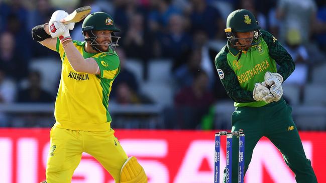 MANCHESTER, ENGLAND - JULY 06:  David Warner  of Australia in action batting as Quinton de Kock of South Africa looks on during the Group Stage match of the ICC Cricket World Cup 2019 between Australia and South Africa at Old Trafford on July 06, 2019 in Manchester, England. (Photo by Clive Mason/Getty Images)