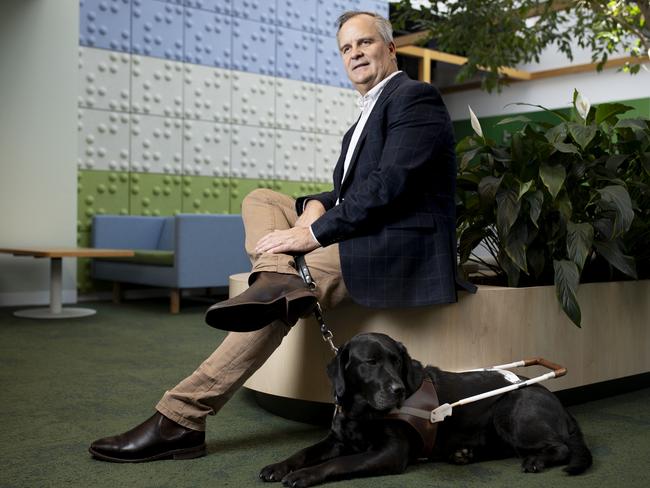 Thursday 5th December 2024.  The Australian.Vision Australia's Manager Government Relations & Advocacy, Chris Edwards with his dog Eva.Photograph by Arsineh Houspian.