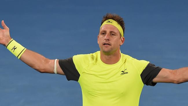 Tennys Sandgren celebrates beating Austria's Dominic Thiem in their men's singles fourth round match. Picture: AFP.