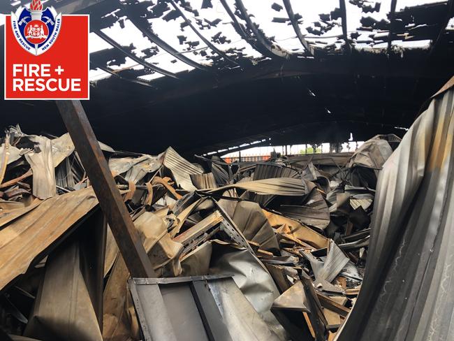 Destroyed storage lockers within the fire damaged main building at Rent A Space. Picture: NSW Fire &amp; Rescue.