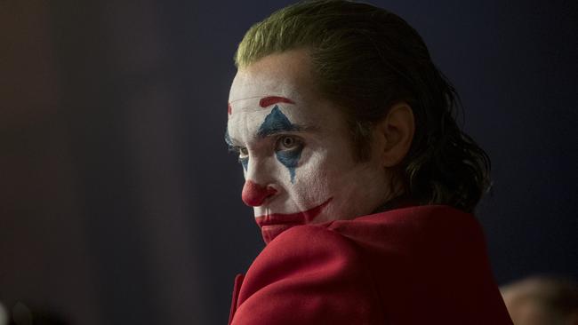 This image released by Warner Bros. Pictures shows Joaquin Phoenix in a scene from "Joker," in theaters on Oct. 4.  (Niko Tavernise/Warner Bros. Pictures via AP)