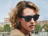 This undated image recived by AFP on Septemner 8, 2021, courtesy of Ray-Ban and Facebook, shows a model wearing smart glasses by Facebook and Ray Ban. - Facebook and iconic eyewear brand Ray-Ban launched their new smart glasses, the latest effort in a tricky, niche market but which the social media giant sees as a step toward its future. The "Ray-Ban Stories" shades can take pictures and video upon the wearer's voice commands, and the frames can connect wirelessly to Facebook's platform through an app. (Photo by Handout / Ray-Ban and Facebook / AFP) / RESTRICTED TO EDITORIAL USE - MANDATORY CREDIT "AFP PHOTO / Ray-Ban and Facebook" - NO MARKETING - NO ADVERTISING CAMPAIGNS - DISTRIBUTED AS A SERVICE TO CLIENTS