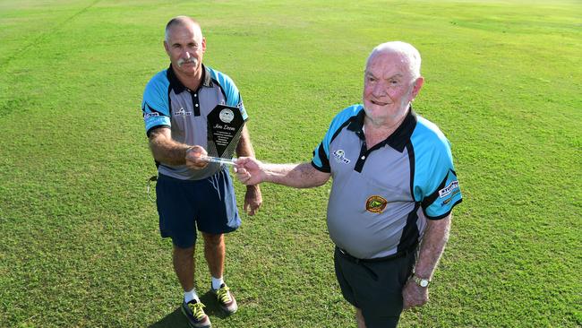 Mick Clarry presents Jim Deem with a plaque for his services to Bundy cricket over the past 50 years.