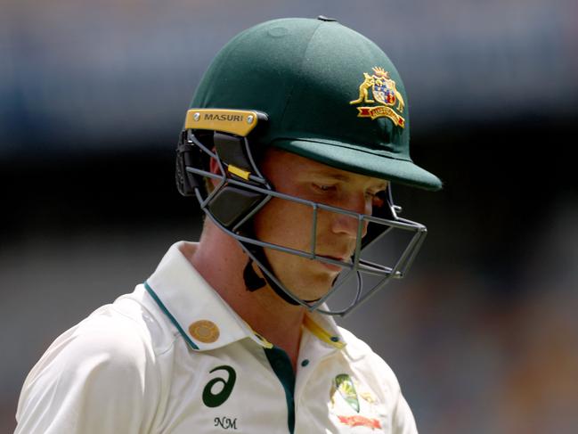 Australiaâs Nathan McSweeney reacts as he walks off the ground after being dismissed on day five of the third cricket Test match between Australia and India at The Gabba in Brisbane on December 18, 2024. (Photo by DAVID GRAY / AFP) / -- IMAGE RESTRICTED TO EDITORIAL USE - STRICTLY NO COMMERCIAL USE --