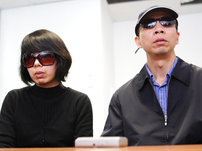 Robert Xie and wife Kathy talk to the media in a press conference at lawyer Daniel Sheen’s World Tower offices in Sydney.