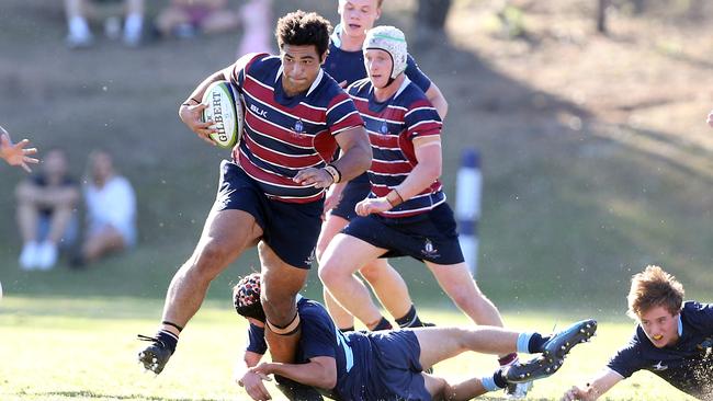 Zane Nonggorr runs over his Brisbane Grammar School opponents. Picture: Richard Gosling