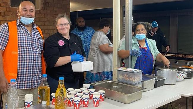 Loganlea Community Centre staff cooking food for flood victims.