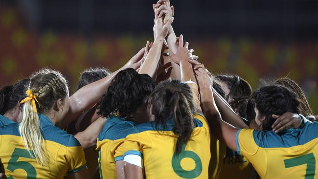 The Australian women celebrating their historic gold.