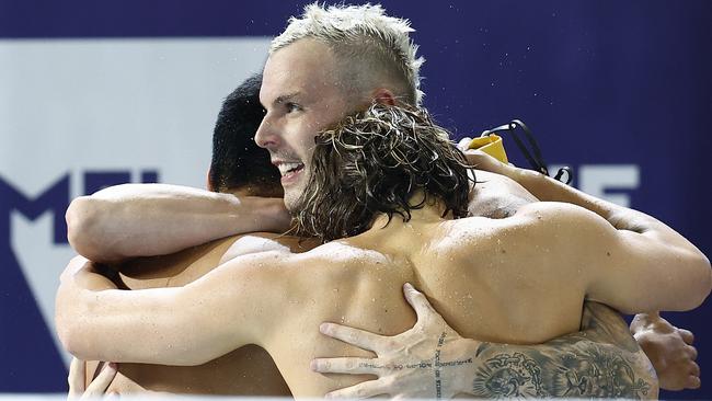 MELBOURNE, AUSTRALIA - DECEMBER 18: Kyle Chalmers, Isaac Cooper, Joshua Yong and Matthew Temple of Australia celebrate winning gold in the Men's 4x100m Medley Relay Final, equalling a new world record with the United States in a time of 3:18.98, on day six of the 2022 FINA World Short Course Swimming Championships at Melbourne Sports and Aquatic Centre on December 18, 2022 in Melbourne, Australia. (Photo by Daniel Pockett/Getty Images)