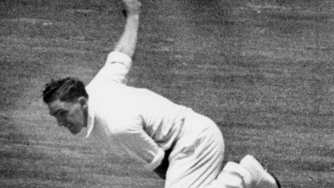 Alan Davidson tears in during an Ashes Test against England.