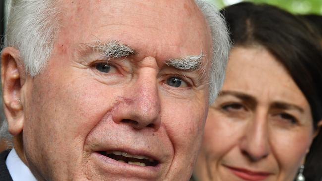 John Howard joined NSW Premier Gladys Berejiklian on a walk through Penrith. Picture: AAP 