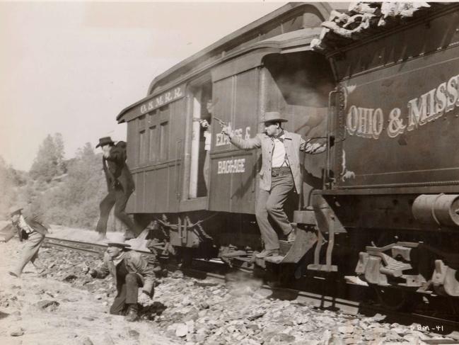 A still from the 1955 film Rage At Dawn showing the Reno Gang robbing a train. RKO Pictures