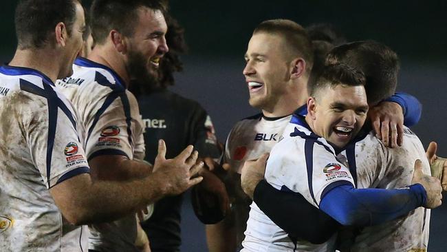 Danny Brough and Lachlan Coote of Scotland celebrate after their draw with NZ.