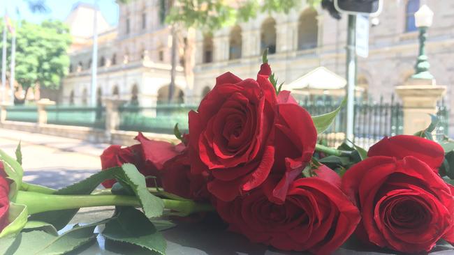 Flowers placed outside Parliament House following news of the murder-suicide.