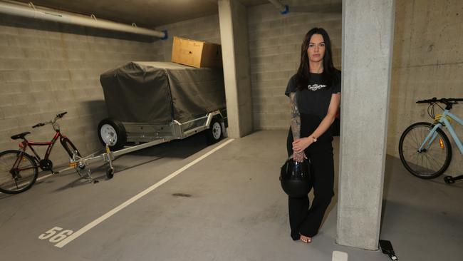 Ms Currie in her parking garage where the motorcycle was stolen. Picture: Mike Batterham