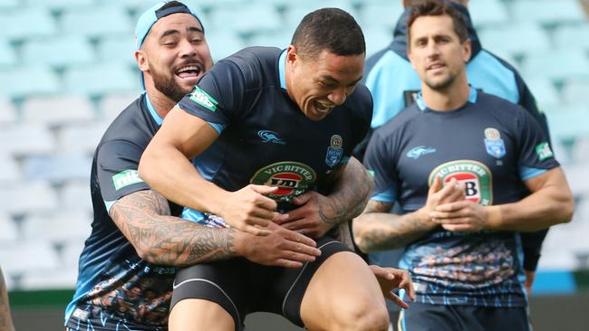 New South Wales Blues player Andrew Fifita (left) lifts teammate Tyson Frizell during their captain’s run training session.