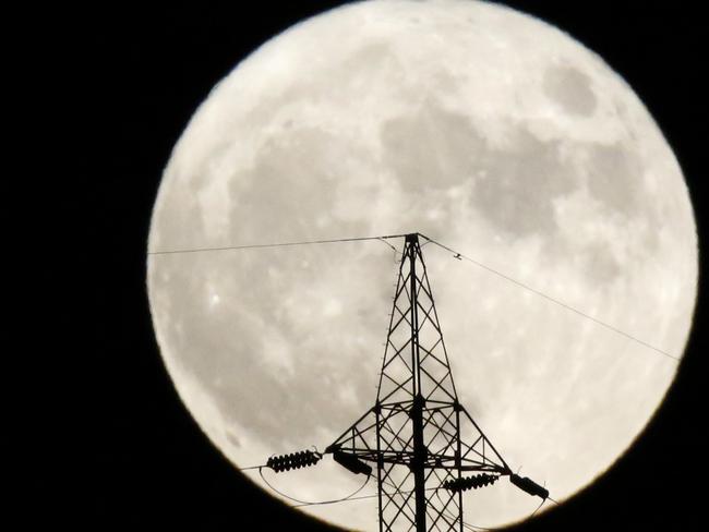 The moon rises behind a power line in Sarajevo, Bosnia, on Monday, Nov. 14, 2016. Picture: AP Photo/Amel Emric