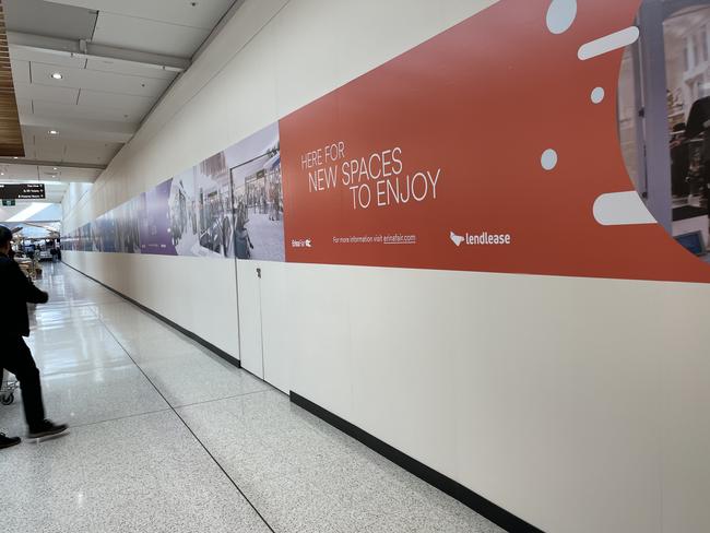 The old Target site has been boarded with signs reading “new spaces to enjoy”.