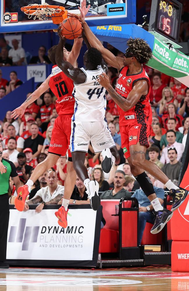 Keanu Pinder of the Wildcats blocks a shot by Sunday Dech of the 36ers. Picture: Getty Images