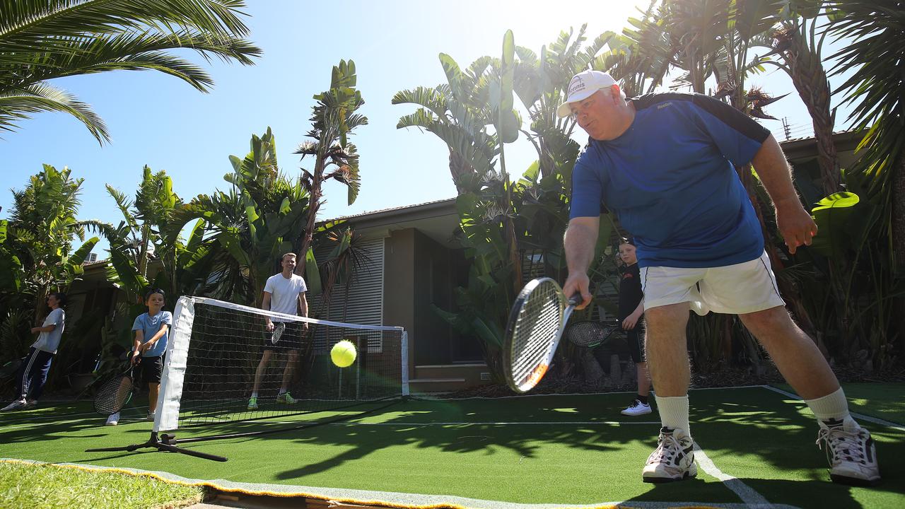 Craig James plays a shot as Hampton neighbours come together for a tennis rally. Picture: Graham Denholm