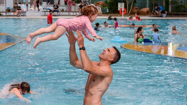 Peter Malinauskas with his daughter Eliza at the Adelaide Aquatic Centre, where he announced plans to redevelop the site if Labor wins the March election. Picture: Brenton Edwards