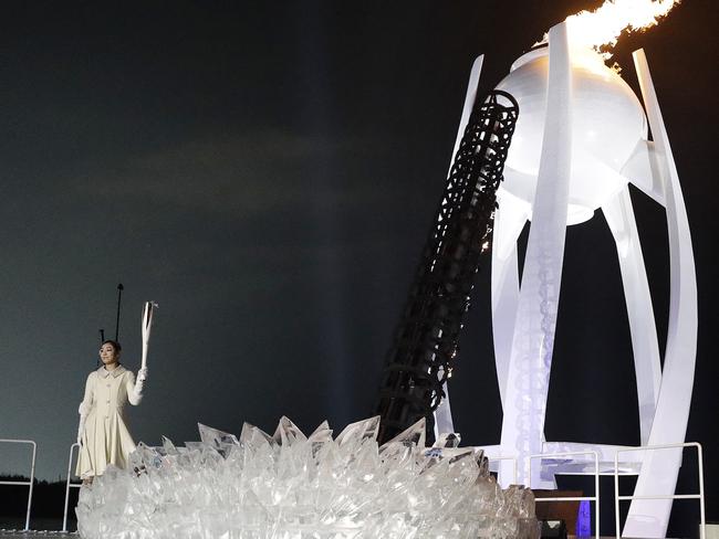 South Korean Olympic figure skating champion Yuna Kim lights the Olympic flame during the opening ceremony of the 2018 Winter Olympics in PyeongChang, South Korea. Picture: AP