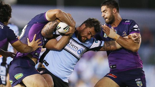 SYDNEY, AUSTRALIA - MARCH 28: Andrew Fifita of the Sharks is tackled by Storm defence during the round four NRL match between the Cronulla Sharks and the Melbourne Storm at Southern Cross Group Stadium on March 28, 2016 in Sydney, Australia. (Photo by Brendon Thorne/Getty Images)