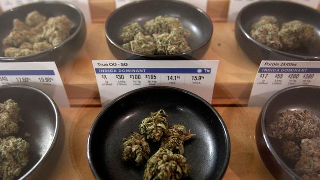 Different types of marijuana sit on display at a marijuana dispensary, with money made from sales boosting the economy. (AP Photo/Mathew Sumner, File)