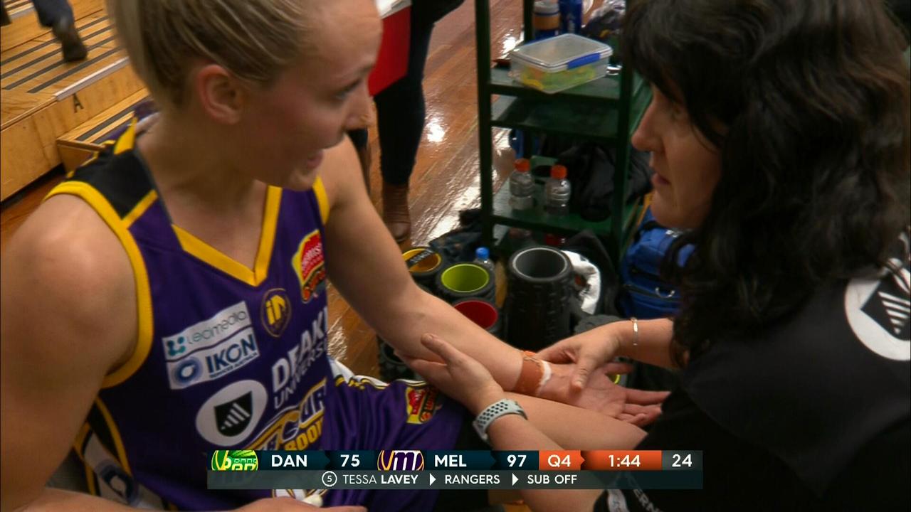 Maddie Garrick gets her left arm checked out.