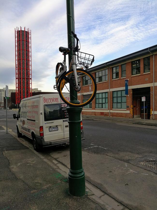 An oBike taped to a lamp post on Dodds St, Southbank. Picture: Martin Sherwood