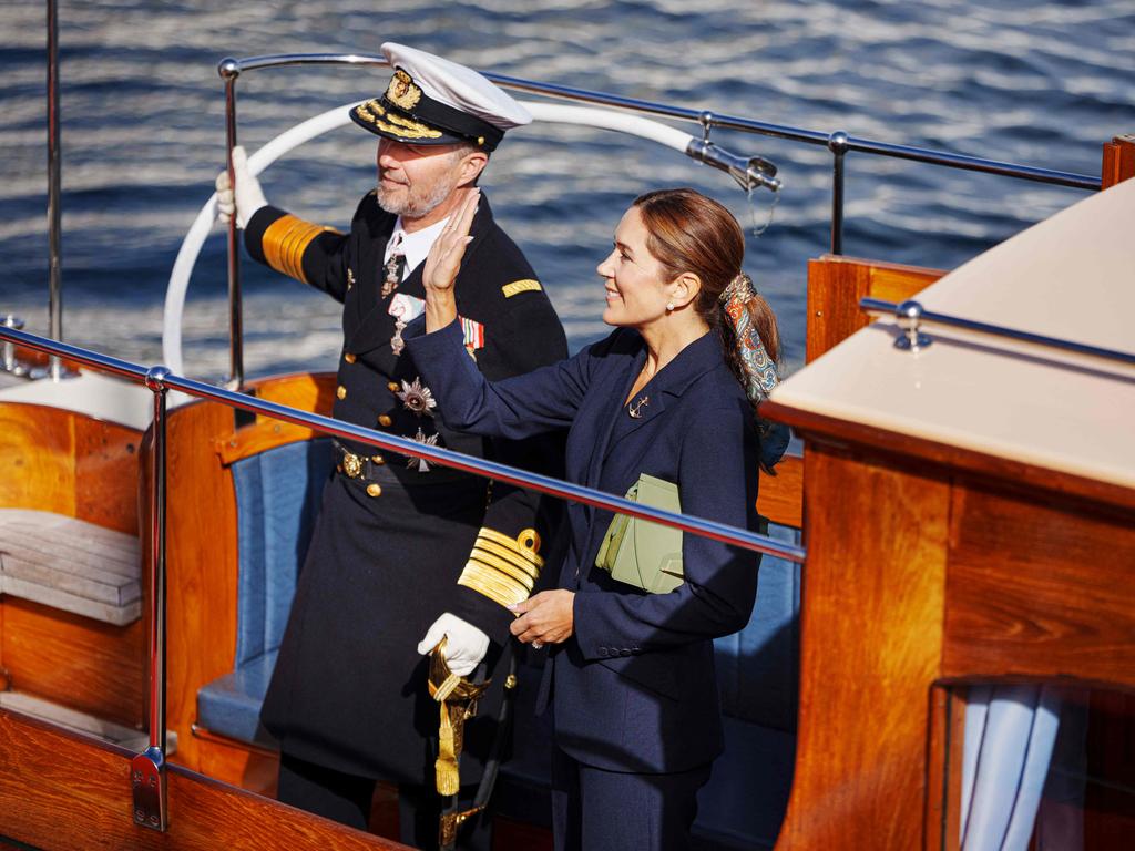 The King and Queen waved to a crowd who had come to see them disembark from the royal ship. Picture: AFP