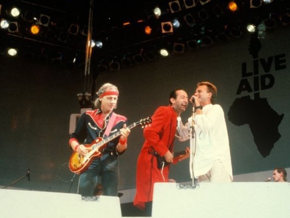 Jack Sonni (middle), with Mark Knopfler and Sting, called performing at Live Aid in 1985 as a “dream come true”. Picture: Getty Images