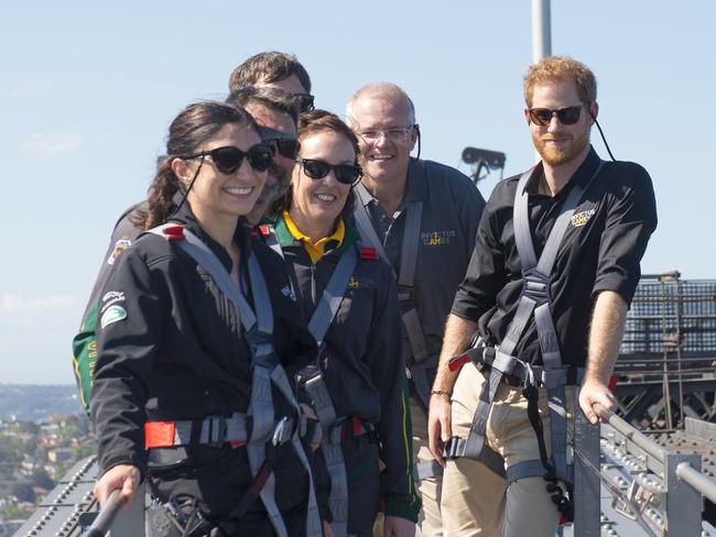 Prince Harry, Prime Minister Scott Morrison, and Invictus Games representatives climb the Sydney Harbour Bridge yesterday. Picture: AP