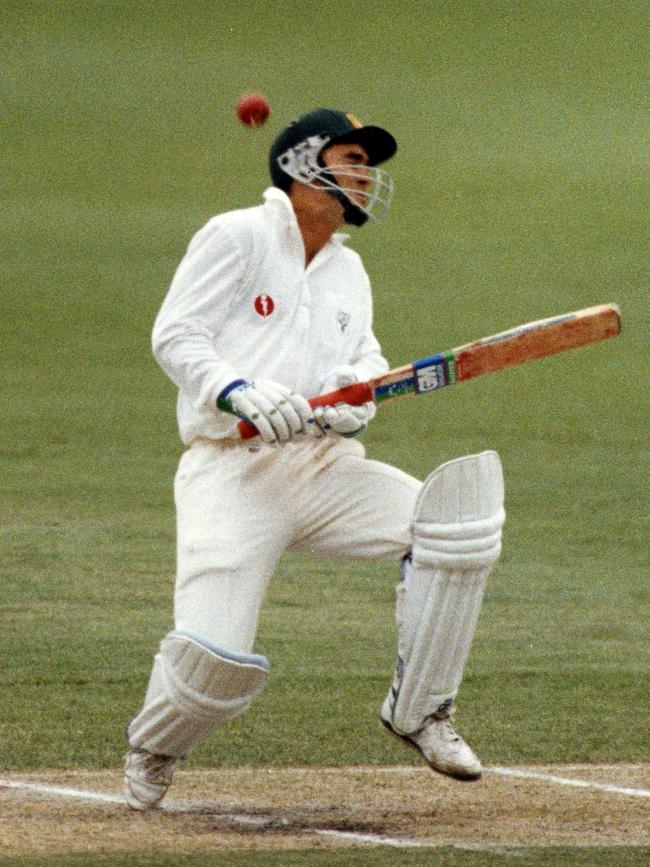 Justin Langer gets hit in the helmet on the first ball he faced in Test cricket in 1993