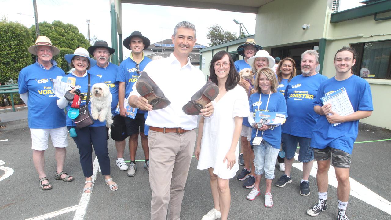 Herman Vorster with worn out shoes and his volunteers at Burleigh Heads on election day. Picture: Richard Gosling