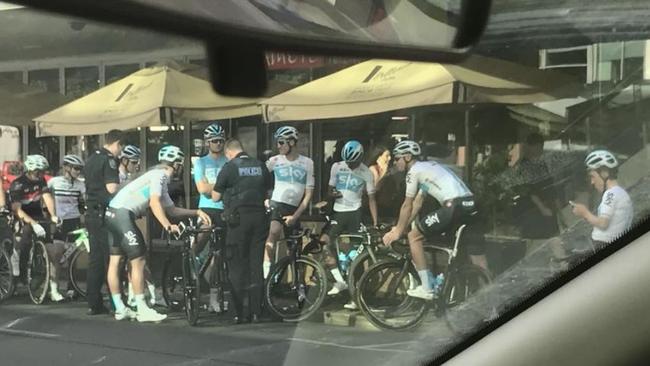 SA police speak to Team Sky riders on Pulteney St. Picture: Jonathon Gelsthorpe