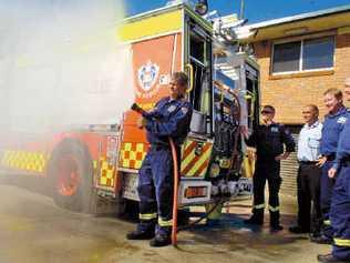 Testing the hoses on their new fire truck are Lismore fire station crew (from left), Captain Brett Lowden, senior firefighter James Connors, Superintendent Chris Fabri, senior firefighter Greg Marker and station officer Ian Grimwood. Picture: CATHY ADAMS