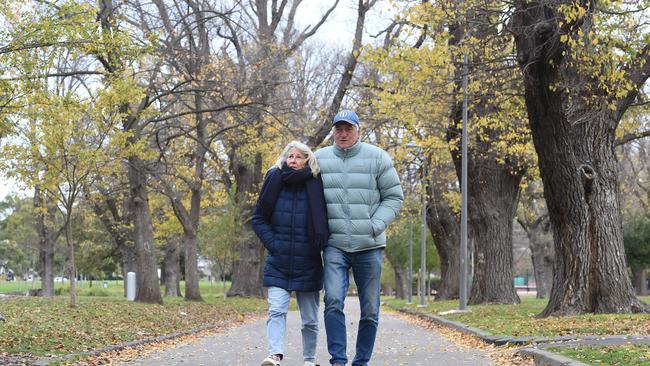 A couple walks through Edinburgh Gardens in North Fitzroy. Picture: NCA NewsWire / Josie Hayden