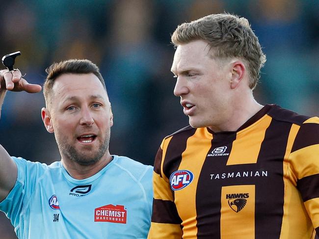 MELBOURNE, AUSTRALIA - JUNE 08: AFL Field Umpire, Brett Rosebury speaks to James Sicily of the Hawks during the 2024 AFL Round 13 match between the Hawthorn Hawks and the GWS GIANTS at UTAS Stadium on June 08, 2024 in Launceston, Australia. (Photo by Dylan Burns/AFL Photos via Getty Images)