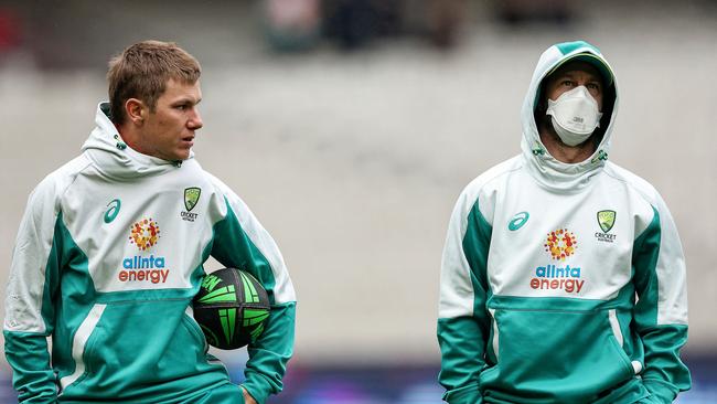 Australia's Adam Zampa (L) talks to Matthew Wade.