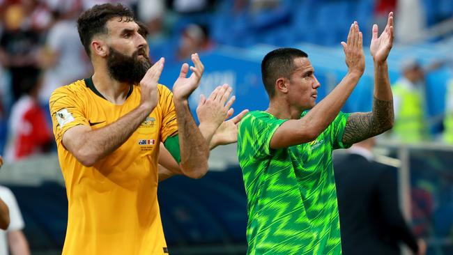 The Socceroos will head into a major tournament without Mile Jedinak (left) and Tim Cahill for the first time in more than a decade. Picture: Toby Zerna