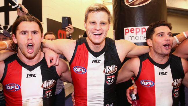 MELBOURNE, AUSTRALIA - JULY 23: Maverick Weller of the Saints, Nick Riewoldt of the Saints and Leigh Montagna of the Saints sing the song in the rooms after winning during the round 18 AFL match between the Western Bulldogs and the St Kilda Saints at Etihad Stadium on July 23, 2016 in Melbourne, Australia. (Photo by Scott Barbour/Getty Images)